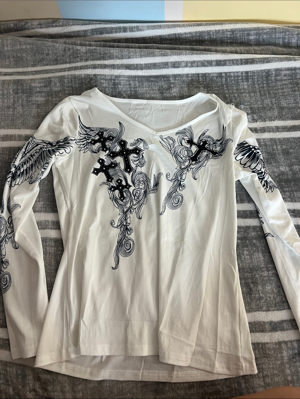 Amazon White Long Sleeve V-Neck Top with Black Cross & Wing Graphics